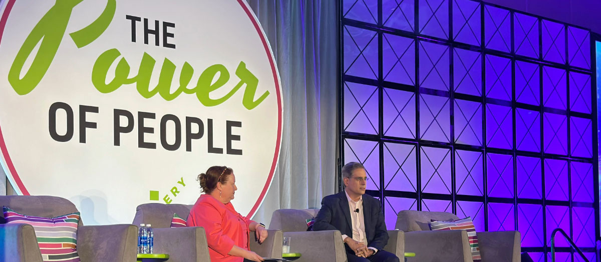  Louis Martin, UNFI’s President of Wholesale and Progressive Grocer’s Editor-in-Chief, Gina Acosta on stage at the Grocery Impact Conference.